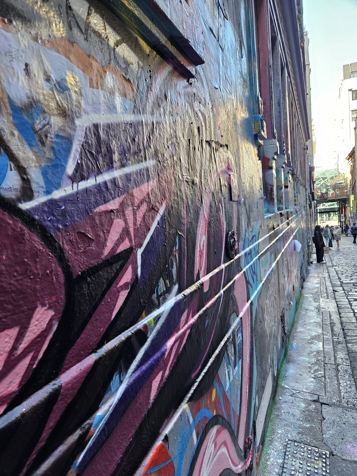 Street art covering the walls of a Melbourne laneway